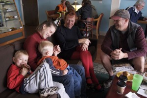Silverton mayor-elect Stu Rasmussen (center) visits with the Banks family during lunchtime at Rolling Hills Bakery in Silverton. 