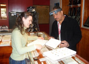 Nicole Kay examines prizes with Jose DeLarosa of Allison and Israel Jewelers.