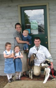Dr. Brian Dietrich with wife, Amanda, and children Johanna, 4; Jennifer, 3; and Gabriel, 1. They\'re joined by their family dog and one of their goats.