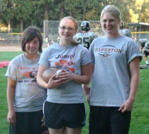 Hannah Roth, left, Rebecca Merrell and Lindsey Kariker are Silverton High football team managers along with Jason Pallister.