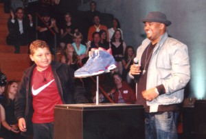 At a benefit auction for Doernbecher Children’s Hospital, Jordan Dark, 12, and Nike shoe designer Jason Mayden, view the special Air Jordan design created by the Mt. Angel Middle School student. The prototype shoe sold for $12,000.     