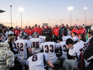 Coaches address the players after the state title game in Hillsboro.
