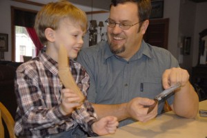 Nathan Klecker, 6, and his dad, Glenn,  an award-winning knife and tool designer, demonstrate safe handling of knives.
