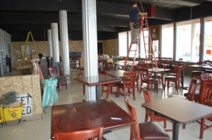 An electrician at works on the Tap Room interior lighting with two and a half weeks to go before opening.       