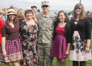 Bitsie, left, Kari, Phil, Annie and Kat Appleton pose for a family picture following deployment ceremonies at Community Stadium in La Grande on Sept. 21.