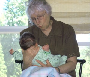 Midwife Betty Griffith visits baby Isaac Shubin, whom she delivered the day before at the Shubin home.