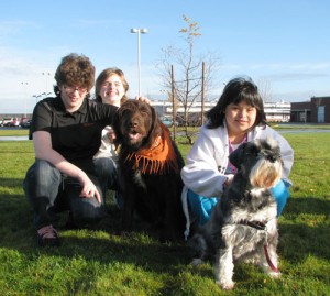 Silverton High School students Alicia Dickson, Raven Gould and Cinthya Barlow with dogs Theo and Maddie enjoy some time outdoors.
