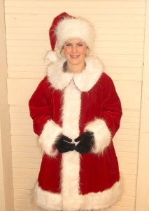 Arianna Gilbert of Silverton gave Santa’s new suit a try.  Santa will debut the suit at the Silverton United Methodist Church Bazaar on Friday, Dec. 3.