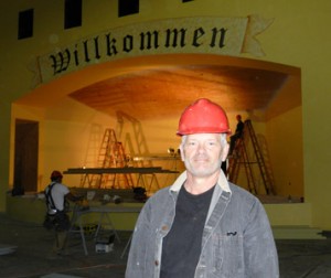 Architect Victor Madge in front of the stage construction during the volunteer work day.