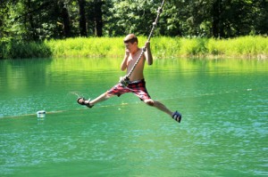 A day camper cools off at the Canyonview Camp lake, where there’s also a water slide, diving board and kayaks. An estimated 1,500 people attend programs at the Christian camp each year.