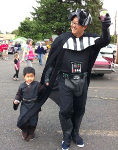 Haiden, 4, and his dad, Dr. Michael Kim, walk in costume in the Homer Davenport parade.