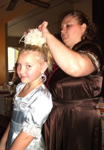 Kaya Gostezskyh fixing Elena Parfiri\'s hair before Christmas breakfast at the Toran home.