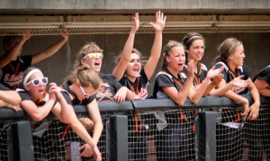 Silverton High School\'s softball team cheering from the dugout.