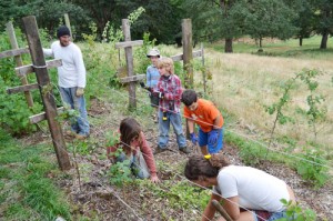 Farm apprentices assist visiting students in farm projects for GeerCrest\'s Farm-Life Experience.