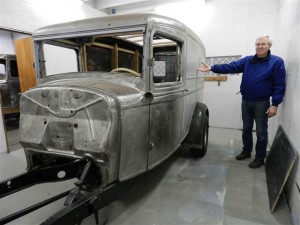 Dale Deshon displays the panel truck on his list for restoration. 
