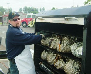 Mike Dahlberg has cooked the ham at the volunteer firefighter’s breakfast for 13 years.