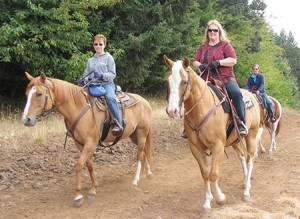 Karen Winter rides Holly while Donna Kamstra rides Jazz and Laura Jirges follows on Larry. Photo by P. Milliren