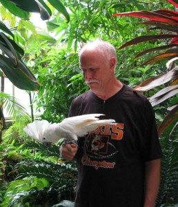 Dr. Tim Peters and Farley the cockatoo. Photo by Brenna Wiegand