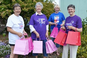 Carolyn Cooley, Patricia Sherwood,  Laura Grunfeld and Jan Boardwell are four of the members of the Thrivers team participating in Silverton’s Relay for Life. They made goody bags to pass out to cancer survivors at the July 18 - 19 event. Photo by Kristine Thomas