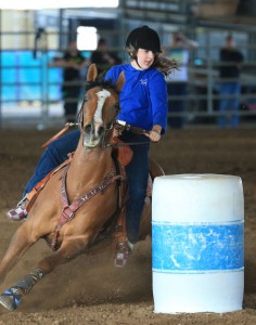 Sarah Larson and her horse Jazzy won several gold medals at the high school state equestrian meet, including barrel racing.