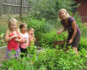 Molly Pattison and Alexis, London and Melissa Wagoner pick vegetables in the garden. Eating locally produced food is a key goal for Rooted in Food proponents.