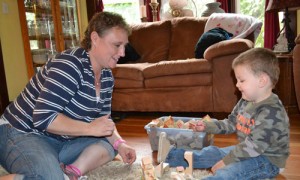 Mount Angel resident Michelle Kurns plays with Harlan, 2, as she shares her story. 