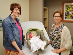 Raelyn Shinn and her daughter visit with certified nurse midwives Nancy MacMorris-Adix.