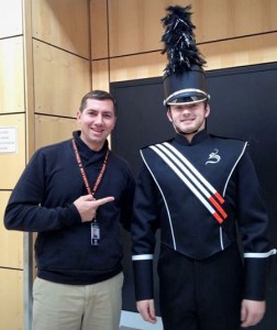 Silverton High School Marching Band leader Frank Petrik with trumpet player Alex Seifer. The SHS senior is modeling a prototype of the new uniforms for which they seek donations.
