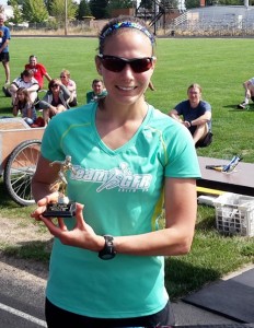 Anna Denn took home the trophy in the women’s competition at the Aug. 9 Homer Classic run 8K run.