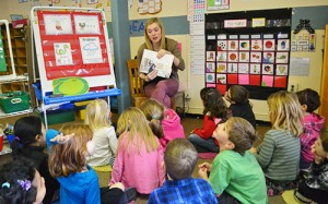 Eugene Field kindergarten teacher Breanna Davis reads a story about Abraham Lincoln to her students.