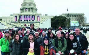 Teacher Kirsten Barnes organized a trip to Washington D.C. for Silverton High students. They were able to attend the inauguration and visit historical sights. The students are standing before the inaugural stage in front of the U.S. Capitol. 