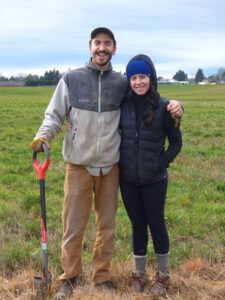 Kurt Berning and Katie Doyle planting white oak seedlings on Bernging’s family farm in Mount Angel. Photo by Melissa Wagoner