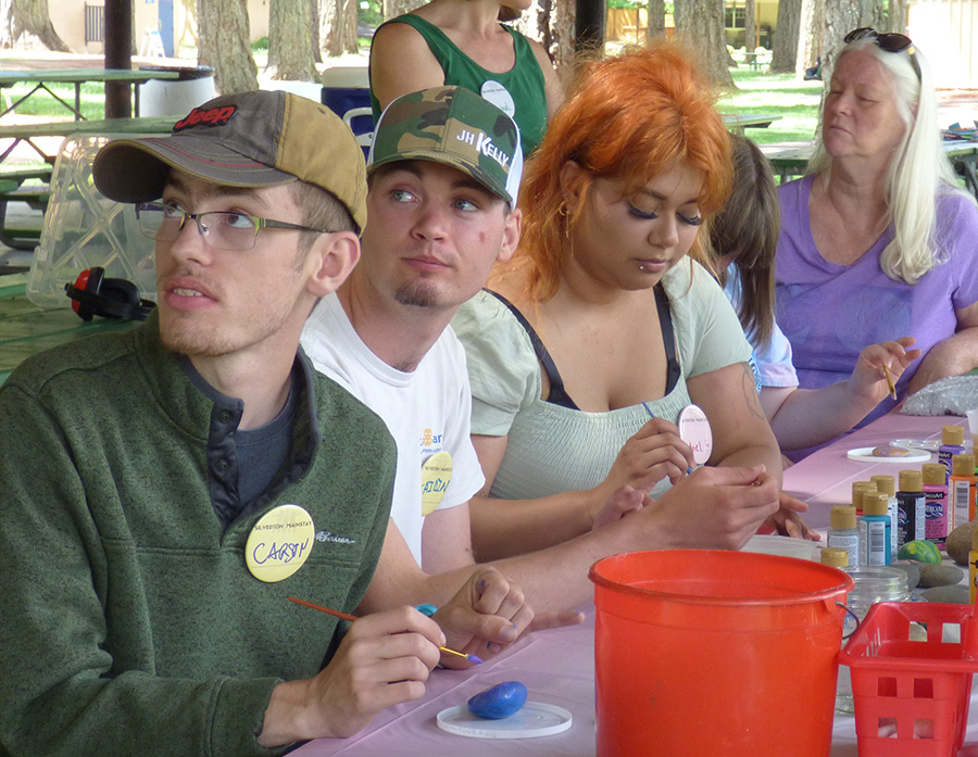 Participants and their supporters painted rocks one afternoon at Coolidge McClaine Park Pavilion.    