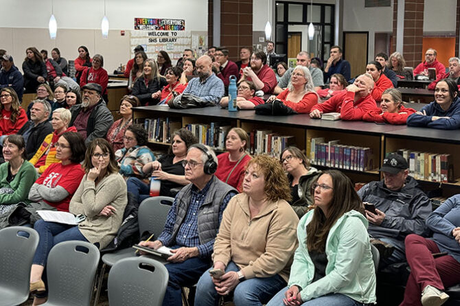 Residents and district employees pack the Silverton High School library for the March 11 meeting of the Silver Falls School District Board amid ongoing discussions of a projected $825,000 deficit. Stephen Floyd