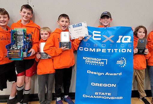 Members of the Think  Robots  club show off their hardware after strong performances at the state tournament in Sandy. From left are  Noah Stoneking,  Jim Zitzelberger, Logan Sullivan, Ezra Vegh,  Aiden Adams, Robbie Bruns and Gus Kowalczyk. Submitted PHOTO