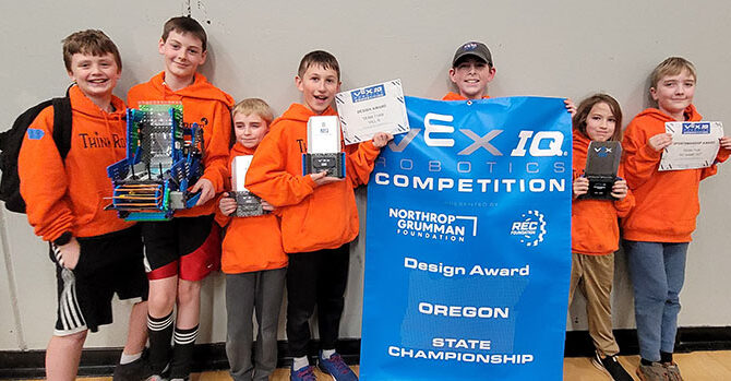 Members of the Think  Robots  club show off their hardware after strong performances at the state tournament in Sandy. From left are  Noah Stoneking,  Jim Zitzelberger, Logan Sullivan, Ezra Vegh,  Aiden Adams, Robbie Bruns and Gus Kowalczyk. Submitted PHOTO