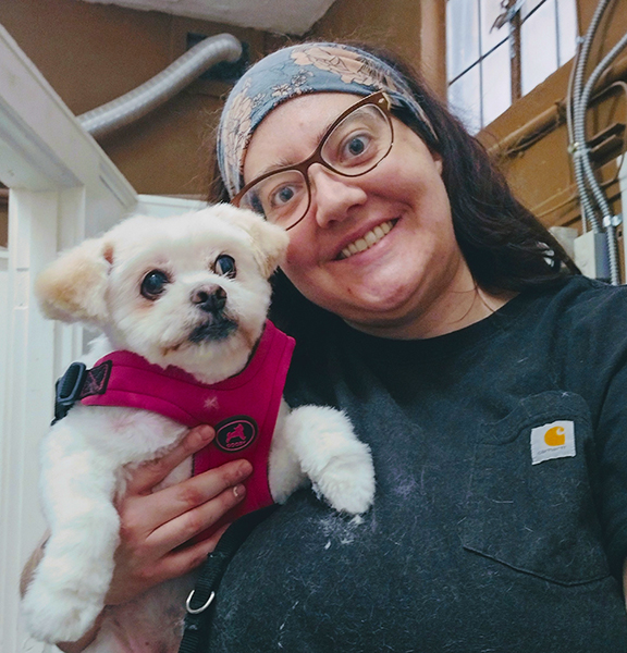 Cassy Proffitt, owner of PNW Pooch in Mount Angel, posing with a customer. Submitted Photo