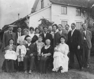 Alexander and Christina Esson, seated in the front row, are surrounded by their children and grandchildren at an early family reunion. Christina’s parents, Hanson and Lavina Stevens, crossed the Oregon Trail in 1852 and settled near Silverton. Christina and Alexander Esson, established a  farm near Mt. Angel that remains in the family today.