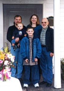 In 2001, a replica of Percy Brown’s home was constructed in Town Square Park. Brown family members pictured at the dedication are, from left, Jeff, sixth generation, Cindy, Norman, fifth generation, and Justin and Tyler, seventh generation     