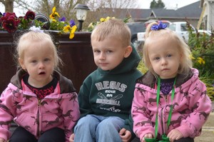 Jacoby Bohnke of Aumsville and his sisters Hailey and Macy will join in the April 27 March of Dimes walk by riding in their wagon. Mom Kathy credits the March of Dimes with funding advances that assisted her twins when they were born 12 weeks premature.  Submitted photo