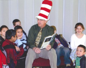 Mount Angel Superintendent Bob Young celebrates Dr. Seuss Day by reading stories to students. 
