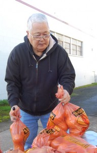Don Wada helps unload food for the Mount Angel Senior Center.