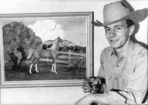A youthful Vern Holmquist next to a painting of the Arabian Borkaan.         