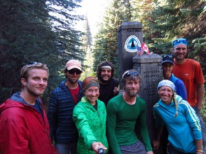 Dorothy Brown-Kwaiser (in green) and her cousin Melissa Kwaiser-DeKalita (right in blue) and their finish team arrive at the monument at the end of the Pacific Coast Trail.