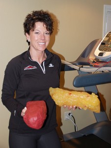 Cindy Woodley shows an example of the difference betweeen muscle and fat. 