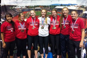 Kennedy High girls track and field athletes Mariah Garcia, left, Taylor Brown, Lauren Stokley, Madison Sprauer, Loghan Sprauer, Mia Grosjacques and Sarah Therkelsen May 23 at Hayward Field in Eugene after winning the Class 2A girls team title.