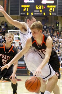 Silverton guard Sam Roth tries to maneuver around Harrison Steiger of Wilsonville Foxes teammate Daniel Larionov moves in to assist. Roth  was named to the all-tournament first team. Photo by Ted Miller