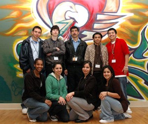 A FBYC retreat group gathers in front of the mural painted for the center by a Carmelite monk. 
