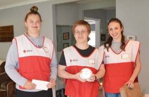 Silverton High School seniors Tessa Oster and Simon Linnebach and freshman Kait Barnes were part of a team helping to install smoke alarms for the American Red Cross. 