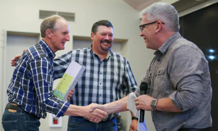 Don Seiler is thanked for 36 years of service to the Mt. Angel Fire District by Battalion Chief Ryan Kleinschmit, center, and Fire Chief Jim Trierweiler, right.